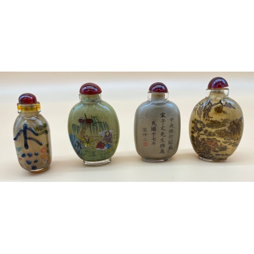 549 - Four Chinese painted perfume/ snuff bottles [9cm high]