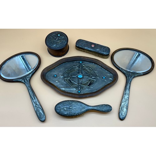 566 - Arts and crafts pewter worked, and Cabochon dressing table set, Ruskin style. Butterfly work to pewt... 