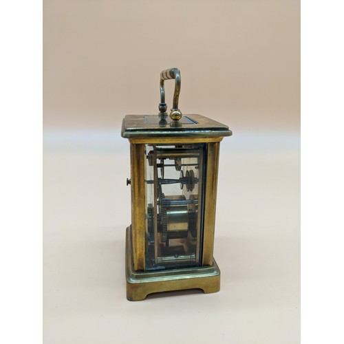 576 - Antique French brass carriage clock with single drum movement, within case