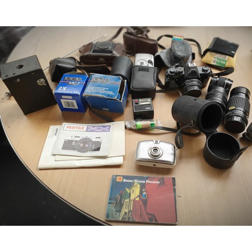 140A - A Collection of Pentax cameras, lenses, tripod and Vintage Kodax and boxed camera