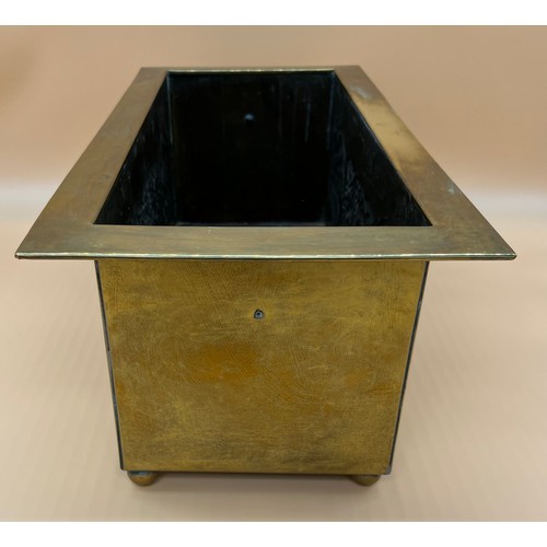 27 - Arts and Crafts brass worked planter. detailed with Celtic panels. [Missing handle] [19x49x24cm]