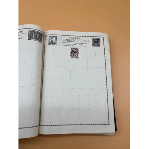 63 - The Triumph stamp album containing a large quantity of stamps from around the world. [Will post]