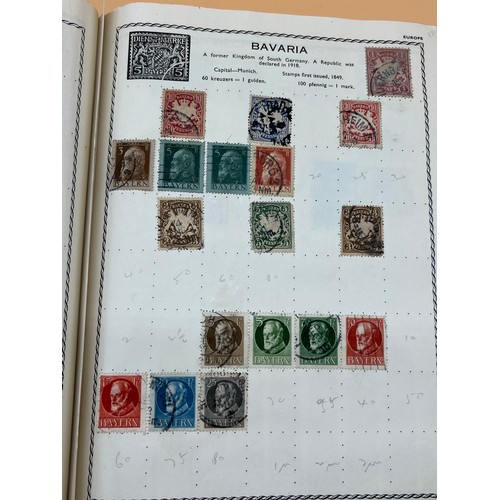 63 - The Triumph stamp album containing a large quantity of stamps from around the world. [Will post]