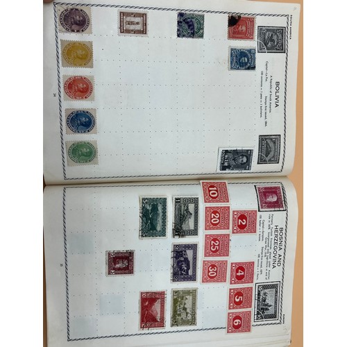 63 - The Triumph stamp album containing a large quantity of stamps from around the world. [Will post]