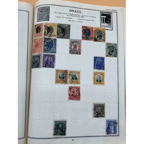 63 - The Triumph stamp album containing a large quantity of stamps from around the world. [Will post]