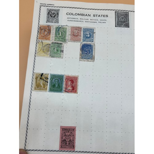 63 - The Triumph stamp album containing a large quantity of stamps from around the world. [Will post]