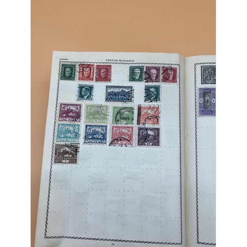 63 - The Triumph stamp album containing a large quantity of stamps from around the world. [Will post]