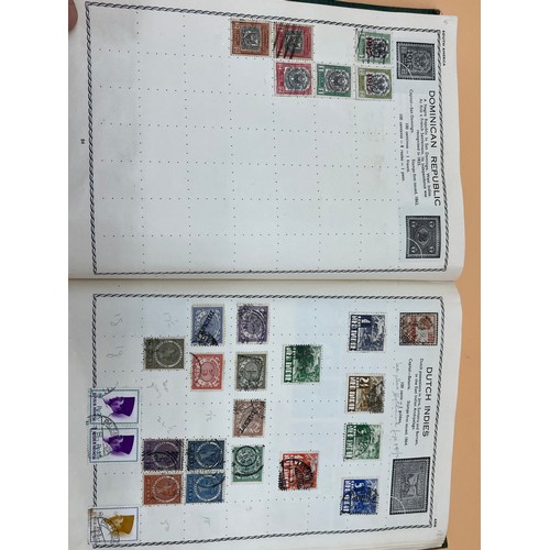 63 - The Triumph stamp album containing a large quantity of stamps from around the world. [Will post]