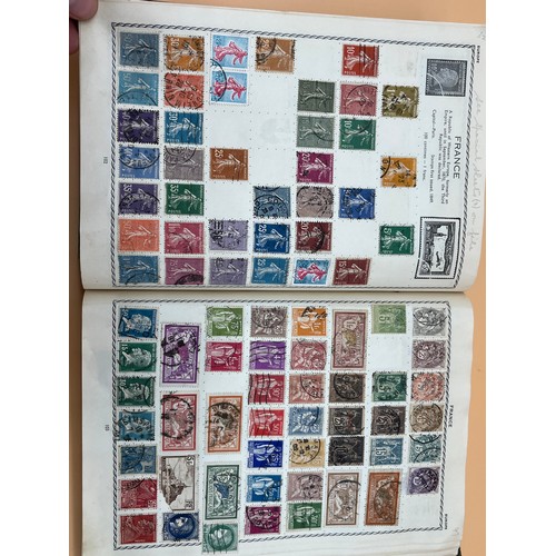 63 - The Triumph stamp album containing a large quantity of stamps from around the world. [Will post]