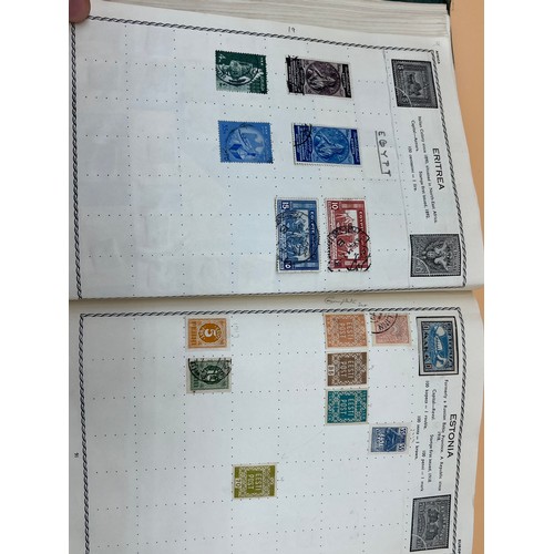 63 - The Triumph stamp album containing a large quantity of stamps from around the world. [Will post]