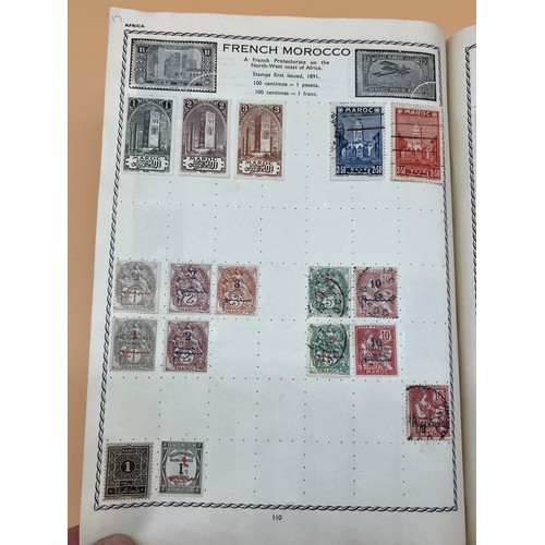 63 - The Triumph stamp album containing a large quantity of stamps from around the world. [Will post]