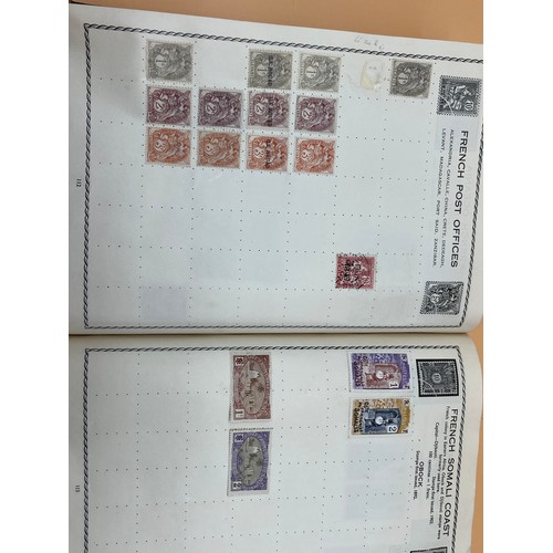 63 - The Triumph stamp album containing a large quantity of stamps from around the world. [Will post]