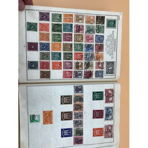 63 - The Triumph stamp album containing a large quantity of stamps from around the world. [Will post]