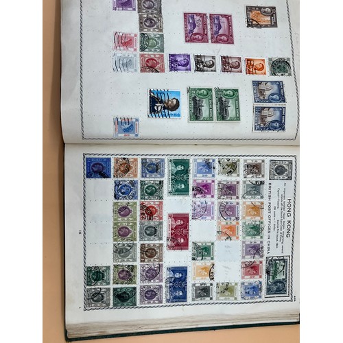 63 - The Triumph stamp album containing a large quantity of stamps from around the world. [Will post]