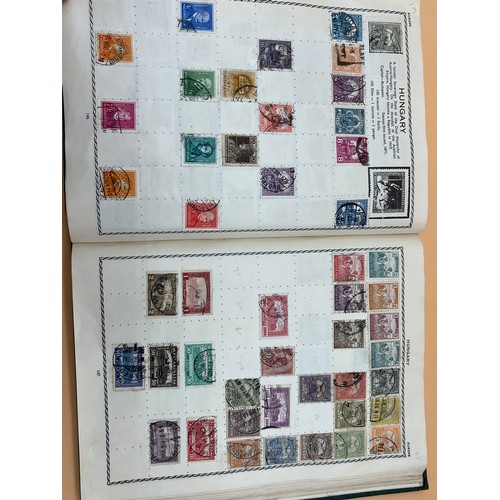 63 - The Triumph stamp album containing a large quantity of stamps from around the world. [Will post]