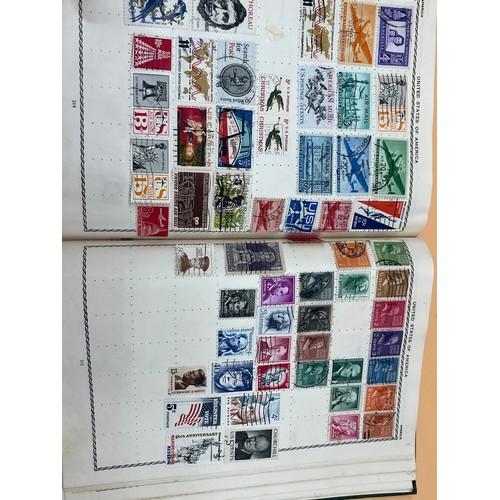 63 - The Triumph stamp album containing a large quantity of stamps from around the world. [Will post]