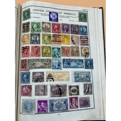 63 - The Triumph stamp album containing a large quantity of stamps from around the world. [Will post]