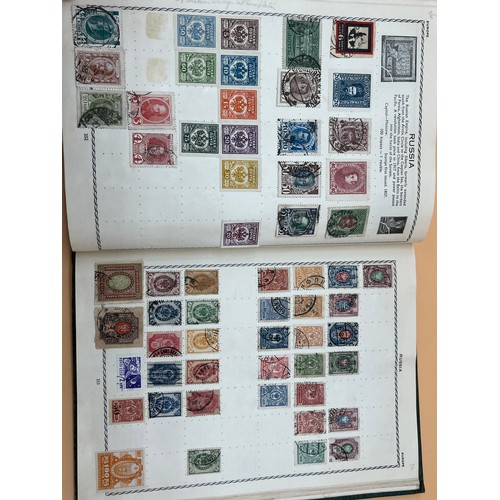 63 - The Triumph stamp album containing a large quantity of stamps from around the world. [Will post]