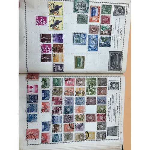 63 - The Triumph stamp album containing a large quantity of stamps from around the world. [Will post]