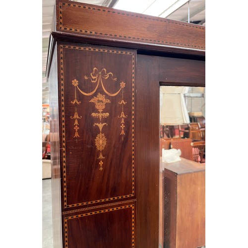 93 - Late 19th century wardrobe, [John Taylor & Son, Edinburgh] the top with inlaid frieze above a single... 