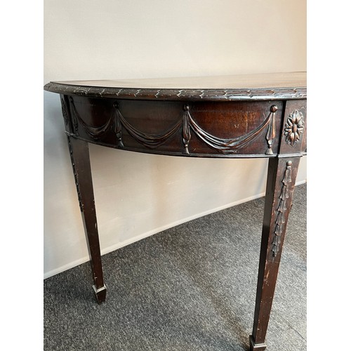 94 - Antique demi lune table, the half-moon top above a moulded frieze, raised on square tapered legs. [7... 