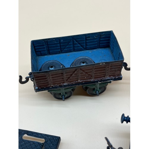 38 - Four antique Bing tin plate train wagons and carriage.