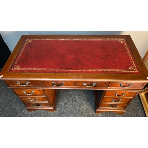 173 - A Reproduction red leather top knee hole writing desk. Splits into three pieces for transportation. ... 