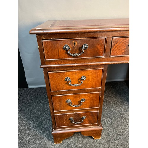 173 - A Reproduction red leather top knee hole writing desk. Splits into three pieces for transportation. ... 