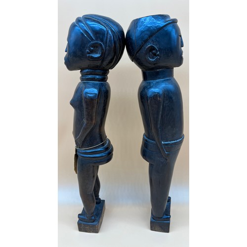 550 - Two Antique African Tribal hand carved figures. Him and her figures. Lady designed with weaved cloth... 