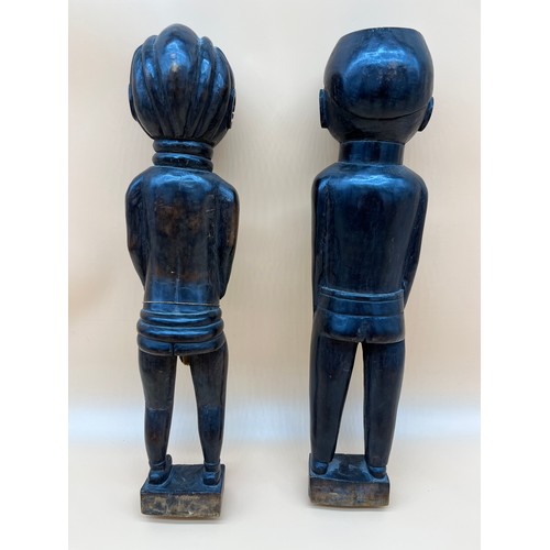 550 - Two Antique African Tribal hand carved figures. Him and her figures. Lady designed with weaved cloth... 