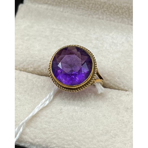 7A - 9ct yellow gold and large amethyst set ring. [Ring size F] [2.69grams]