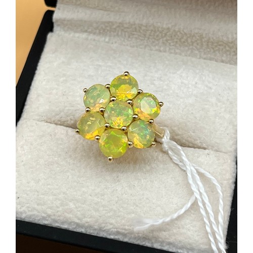 11A - 10ct yellow gold ladies ring set with 7 opalescent style stones. [Ring size P] [3.86gram]