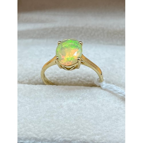 13A - 10ct yellow gold ring set with a large opalescent style stone. [2.14grams] [Ring size R]