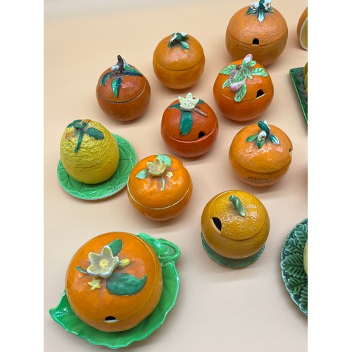 24A - A Collection of various porcelain makers marmalade preserve pots in the form of oranges and lemons. ... 