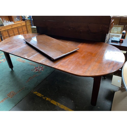 151a - Large 19th century extendable dinning room table on casters .