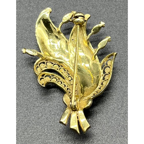 503 - 14ct yellow gold ornate brooch designed with marcasite stones. [6.02grams]