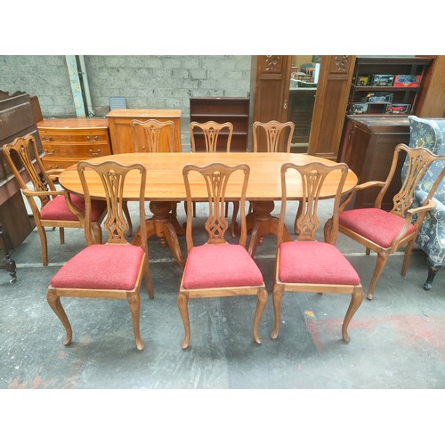 295 - 20th century Pitch Pine dinning room Table together with 8 chairs includes 2 carvers