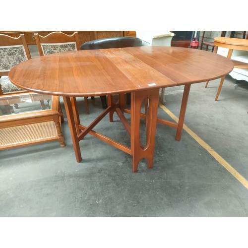 284 - Mid Century Drop leaf dinning room teak table .