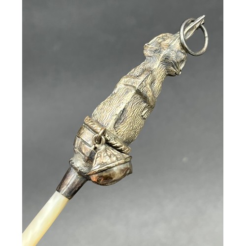 30 - Birmingham silver and mother of pearl handle baby rattle. Silver is formed in the shape of a rabbit ... 