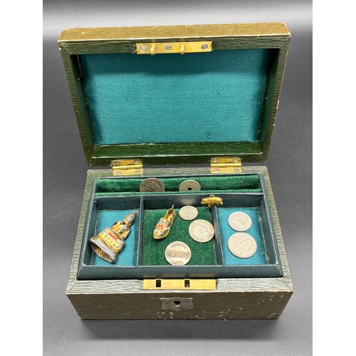 31 - Small antique leather jewel box and contents. Includes various silver coins, Oris ladies wrist watch... 