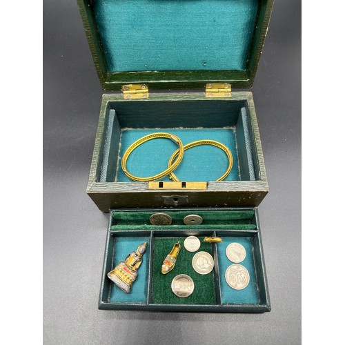 31 - Small antique leather jewel box and contents. Includes various silver coins, Oris ladies wrist watch... 