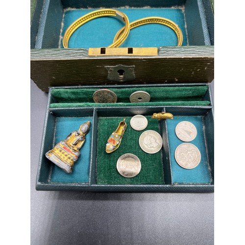 31 - Small antique leather jewel box and contents. Includes various silver coins, Oris ladies wrist watch... 