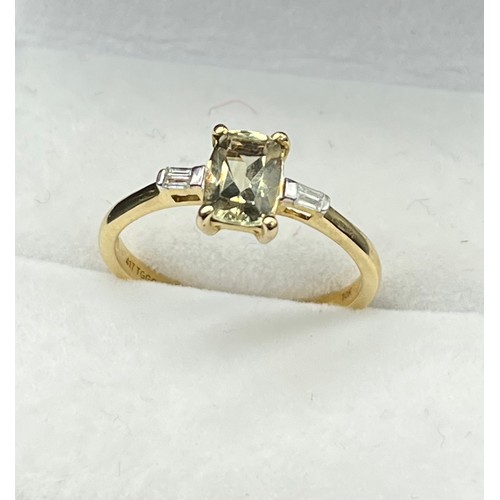 42 - 10ct yellow gold ladies ring set with a single emerald cut pale green topaz stone of set by emerald ... 