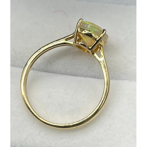 47 - 10ct yellow gold & opalescent style cut stone ring. [2.36grams] [Ring size R]