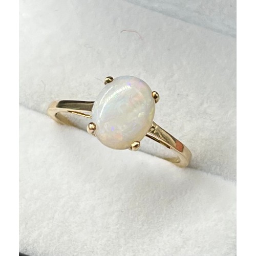 48 - 10ct yellow gold ladies ring set with a single oval opal stone. [Ring size R] [1.71GRAMS]