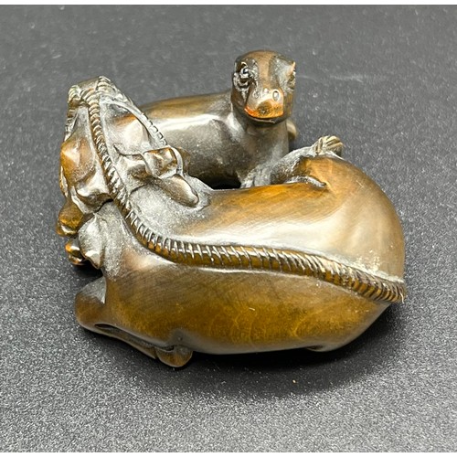 50 - Hand carved Japanese Netsuke sculpture of a An Ox and foal. Signed [4cm in length]