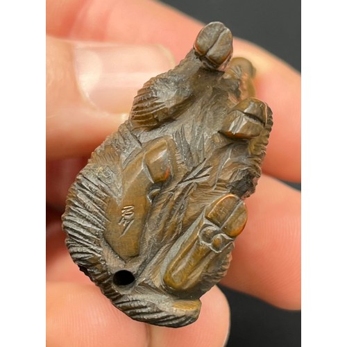 51 - Hand carved Japanese Netsuke sculpture of a Mother Ram and baby on back. Signed. [4.5cm high]