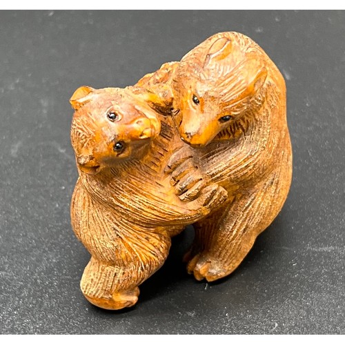 52 - Hand carved Japanese Netsuke sculpture of two bears fighting. Signed. [4.4cm high]