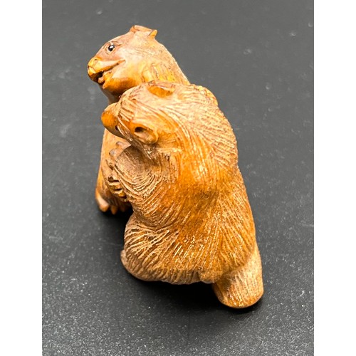 52 - Hand carved Japanese Netsuke sculpture of two bears fighting. Signed. [4.4cm high]