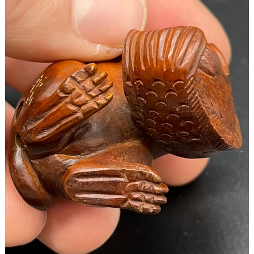 61 - Hand carved Japanese Netsuke sculpture of a Mouse holding a koi carp. [5.2cm high]